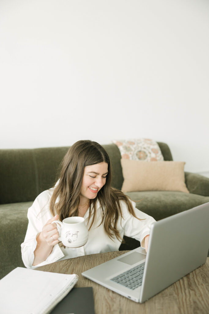 Personal branding photo of Milwaukee realtor with laptop and coffee cup