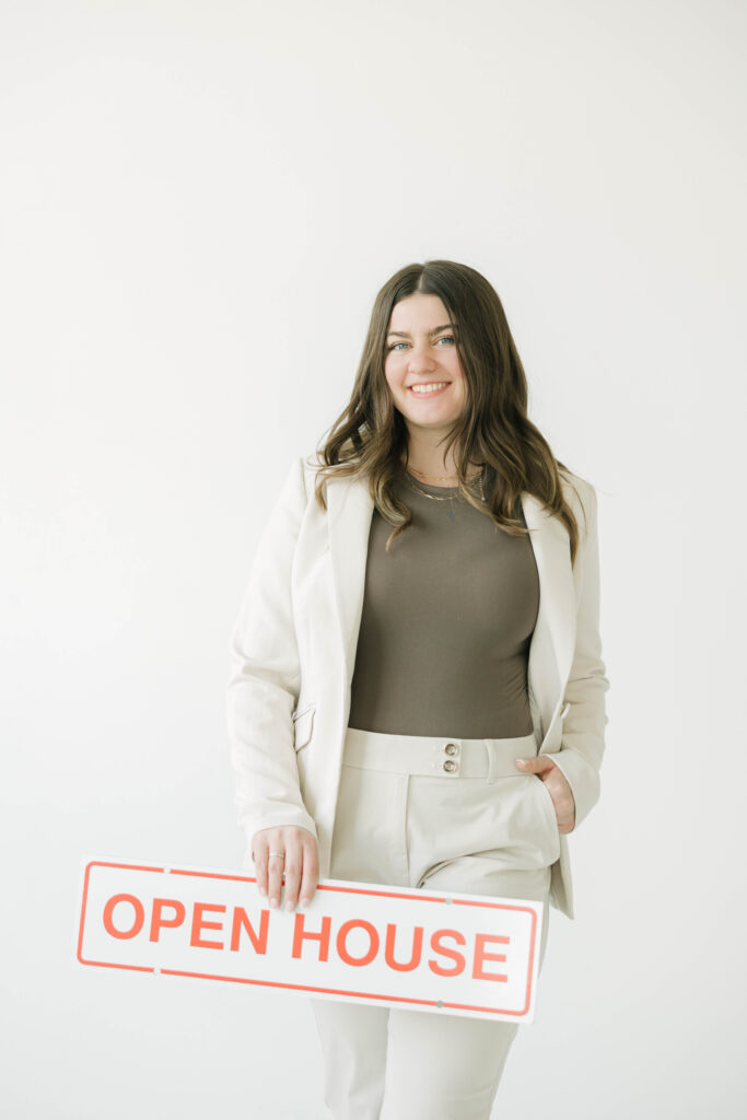 Realtor brand session with open house sign and minimal background