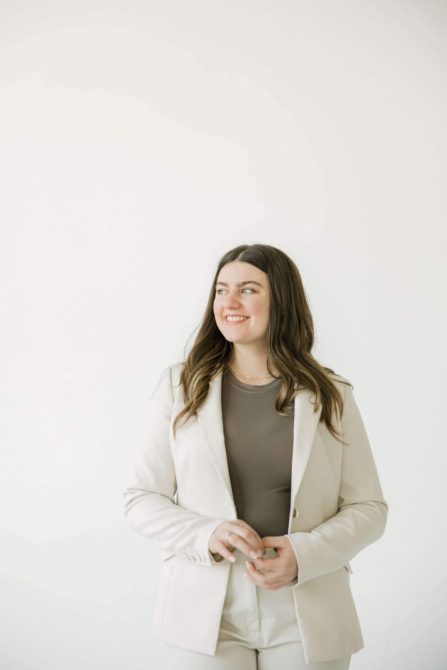 Polished professional headshot of Milwaukee realtor during brand shoot