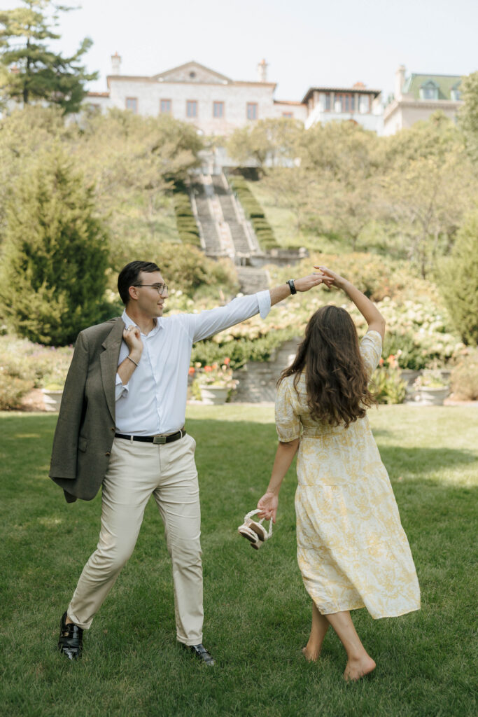 Groom-to-be admiring his fiancée at Villa Terrace during their romantic engagement session