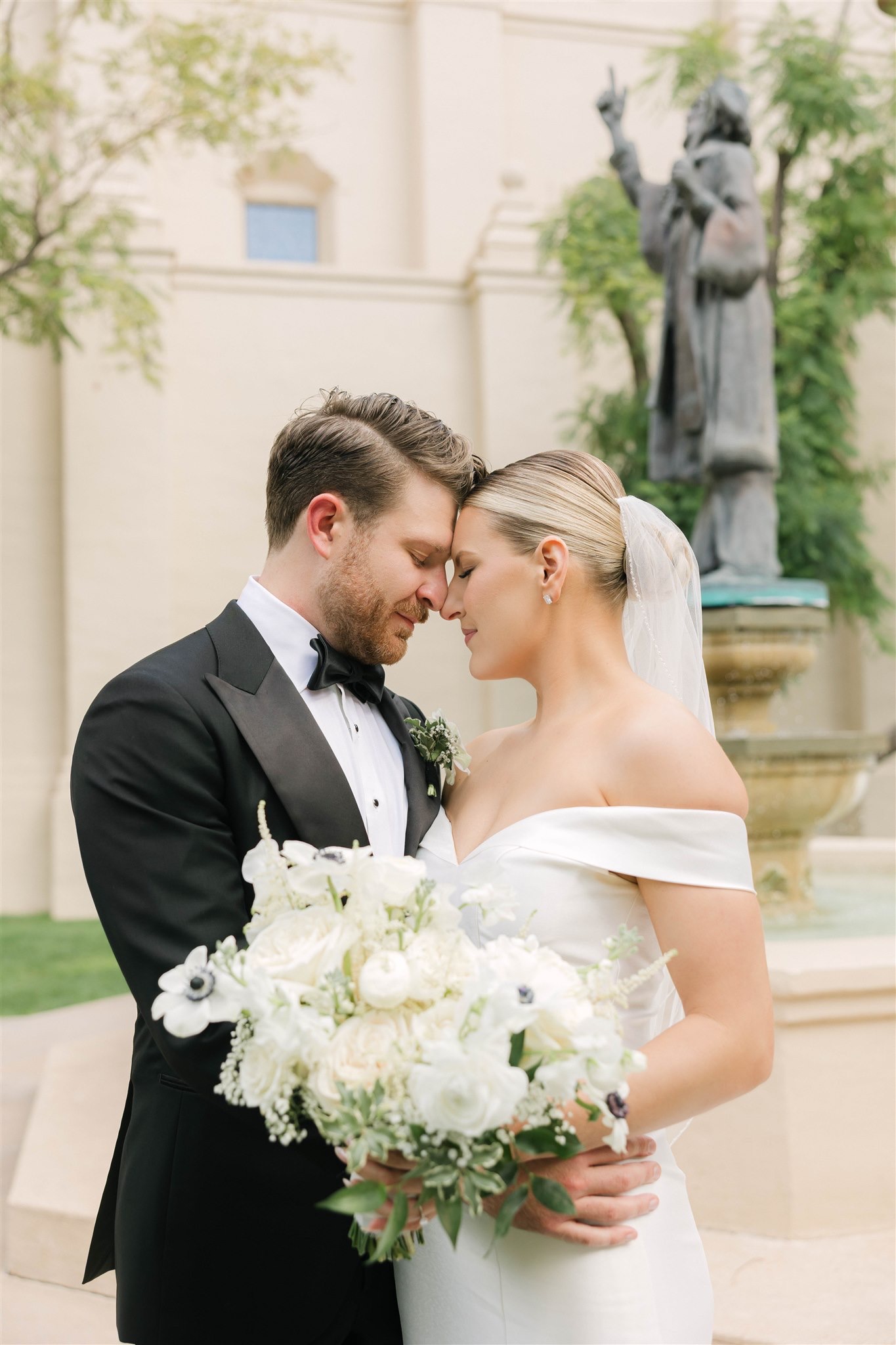 A romantic wedding portrait of the bride and groom outside Brophy Chapel in Phoenix, Arizona. Captured by Alexia Rodriquez in a timeless, editorial style.