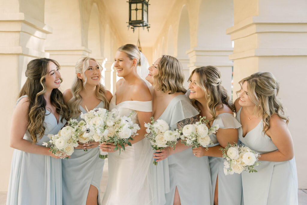 Bride and bridesmaids portrait at luxury Phoenix wedding at Brophy Chapel in Phoenix, Arizona.