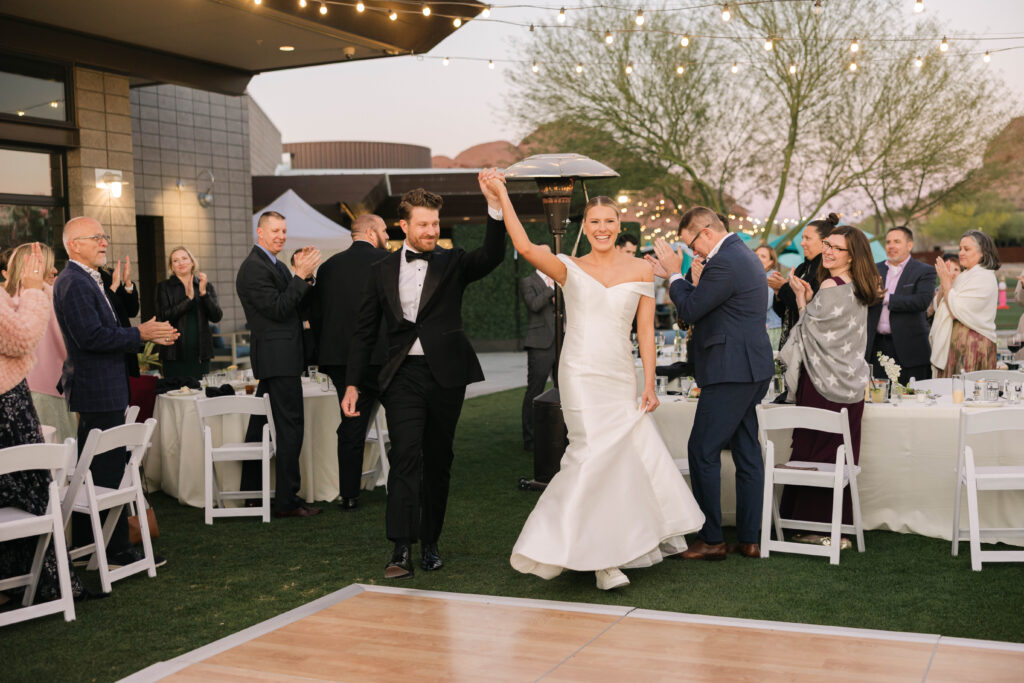 Bride and Groom's grand entrance at their Phoenix wedding at Papago Golf Club.
