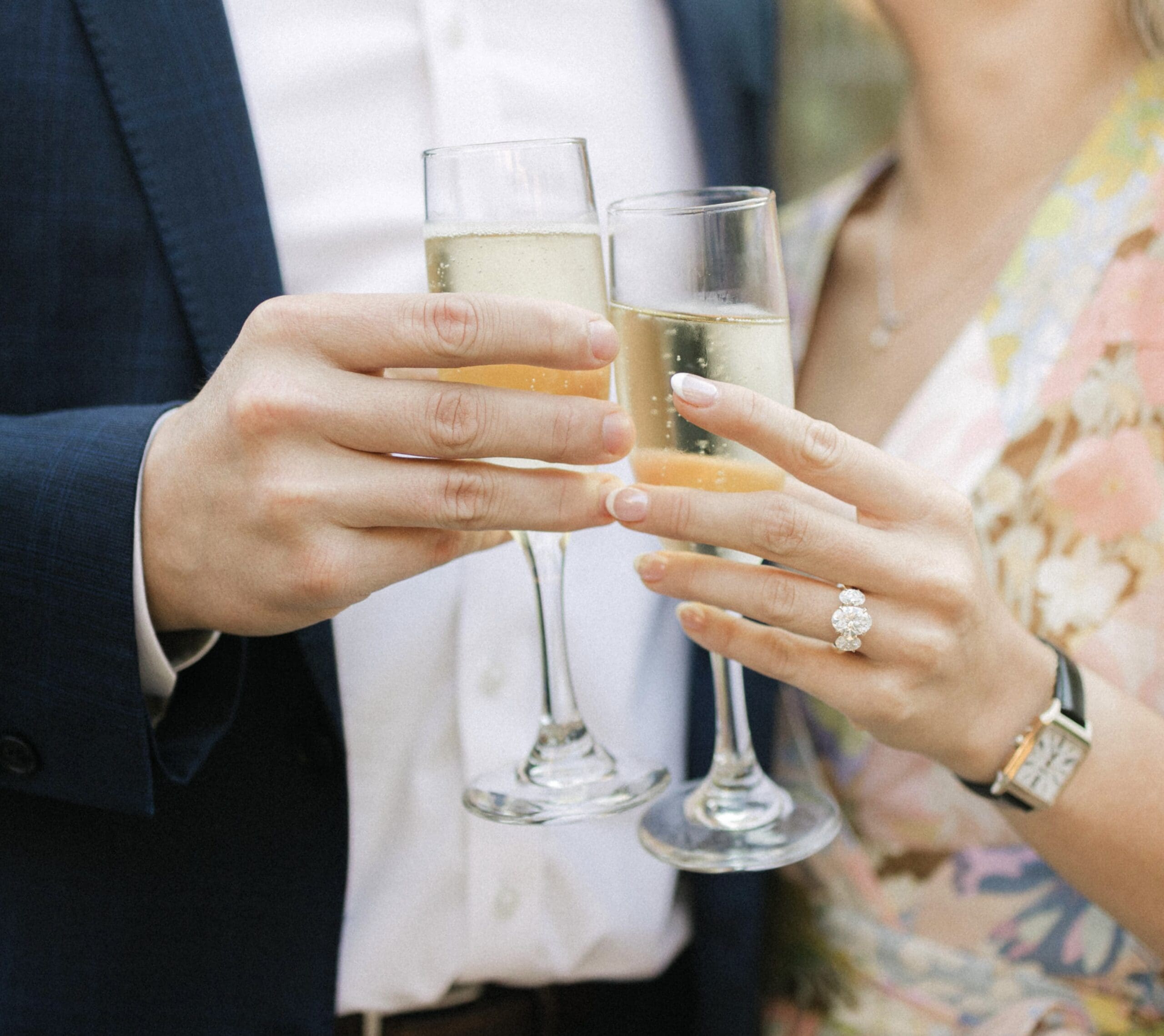 Close-up of an engaged couple toasting with champagne after getting engaged at the American Club in Kohler.