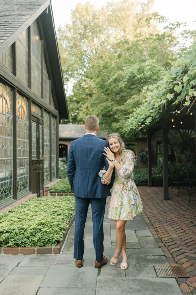 Engaged couple posing for a portrait at The American Club in Kohler