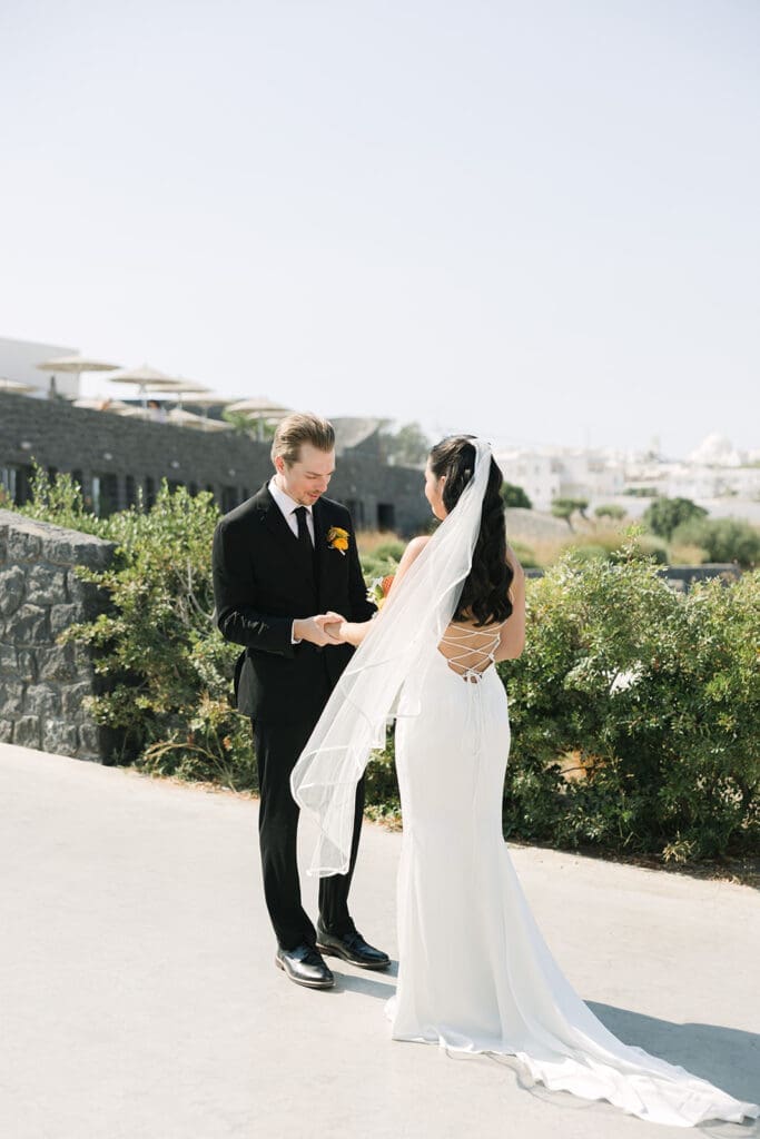 emotional first look at Orama Hotel Santorini wedding