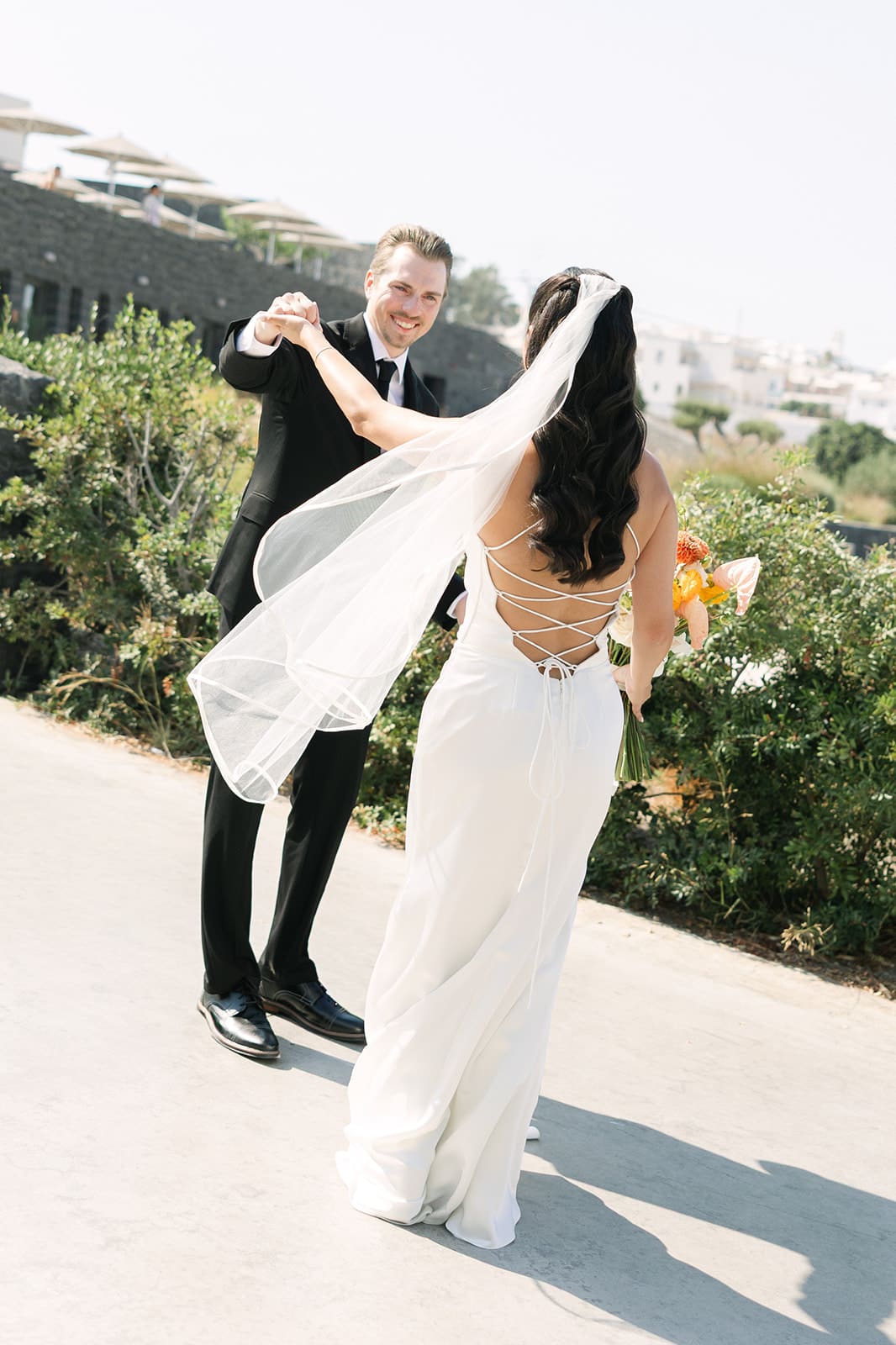 bride and groom seeing each other for the first time in Santorini