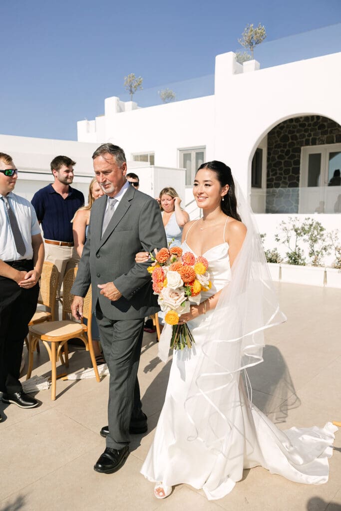 bride walking down the aisle at Le Ciel in Imerovigli