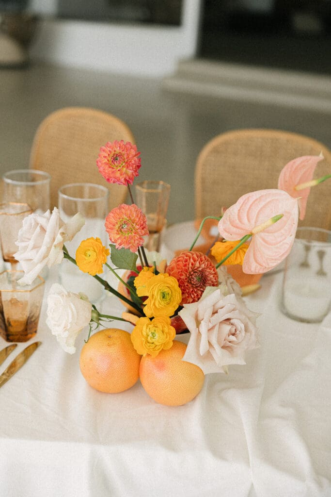 reception details with layered linens and florals Santorini wedding