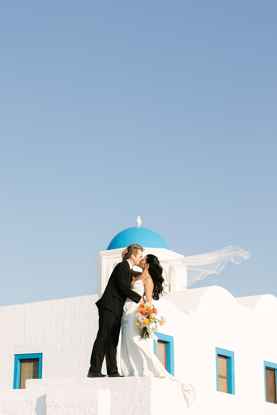 Bride and groom portrait at their Santorini wedding.