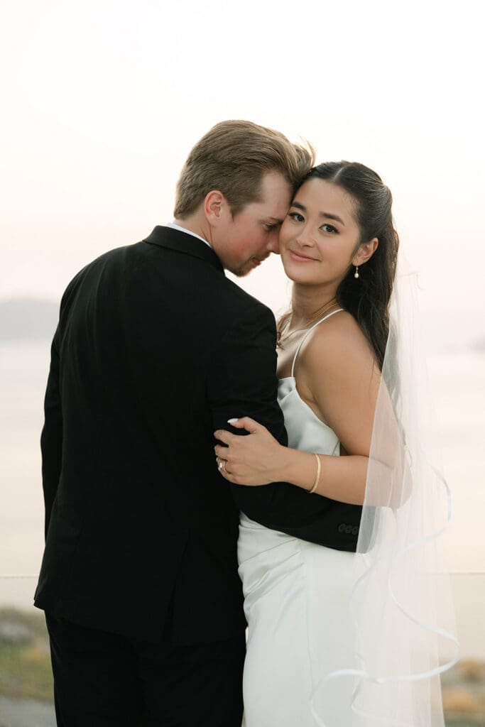 bride and groom at sunset during Santorini wedding