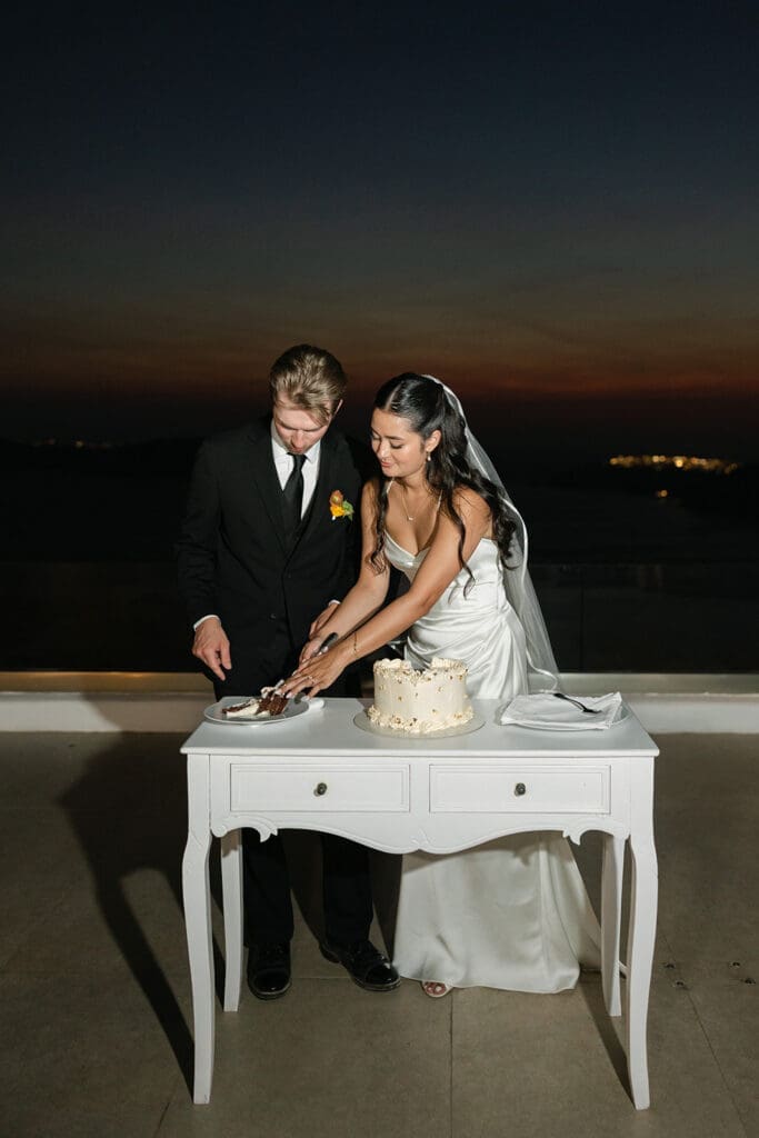 wedding cake cutting at Le Ciel Santorini
